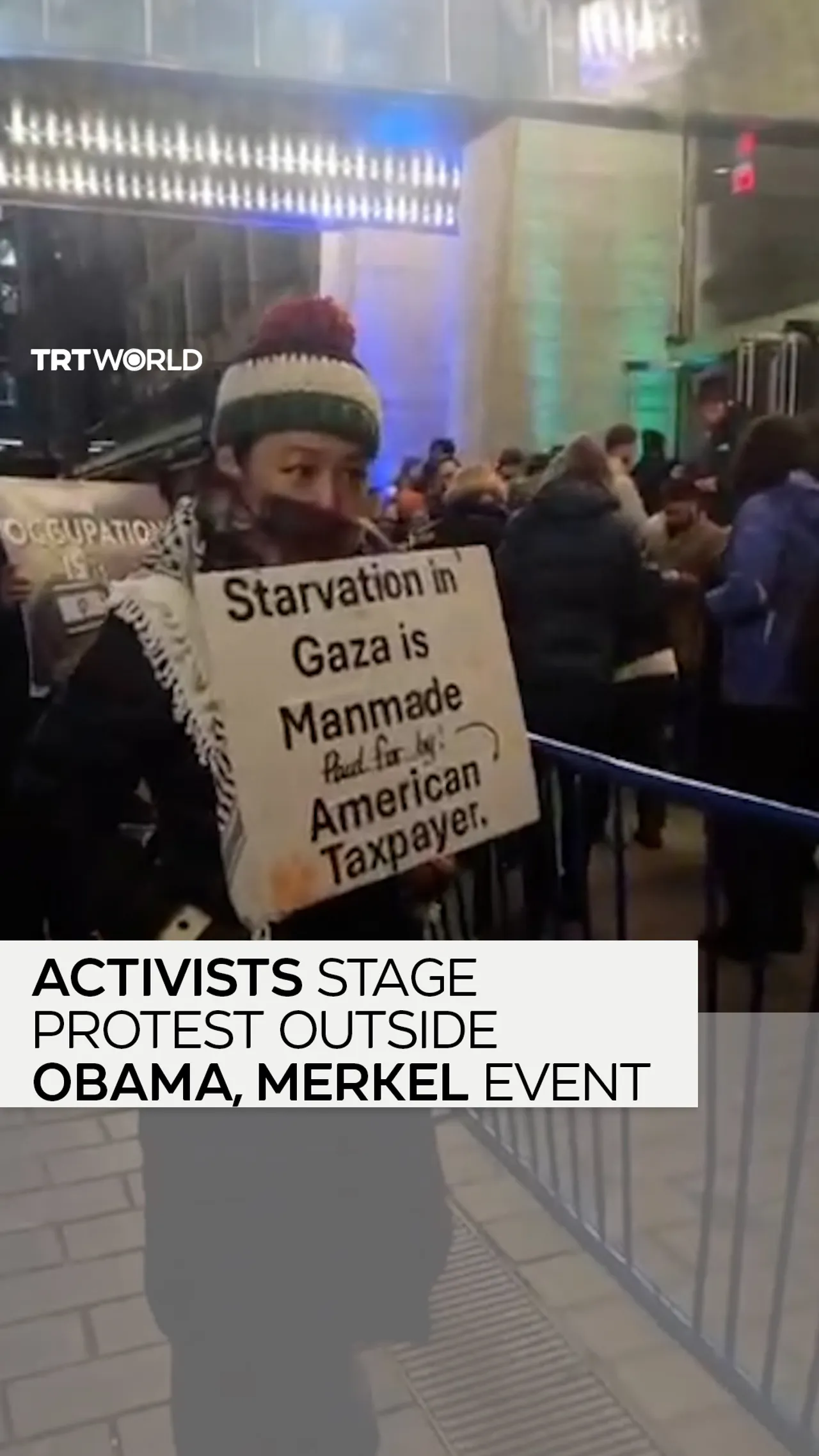 Activists stage protest outside Obama, Merkel event
