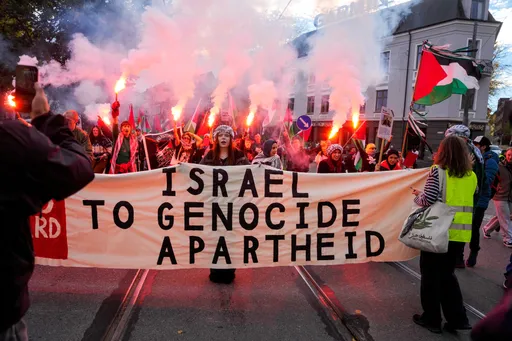 Thousands flash 'Red Card' to Israel over Gaza genocide ahead of World Cup qualifier