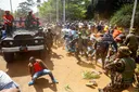 Chaos as Kenya police fire tear-gas mourners gathered to view Odinga's body