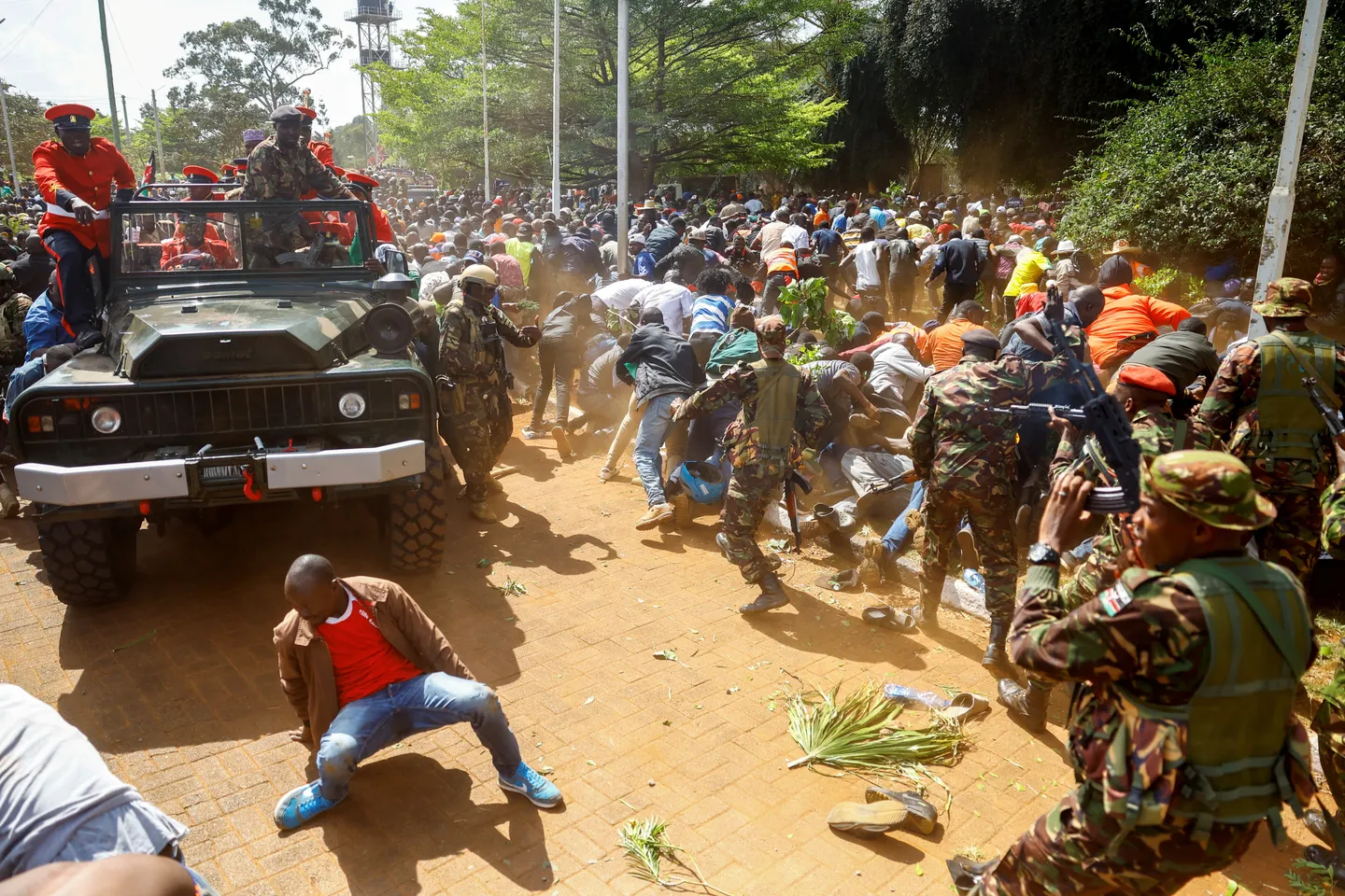 Chaos as Kenya police fire tear-gas mourners gathered to view Odinga's body
