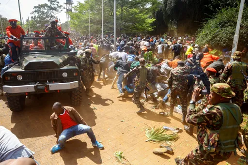 Chaos as Kenya police fire tear-gas mourners gathered to view Odinga's body