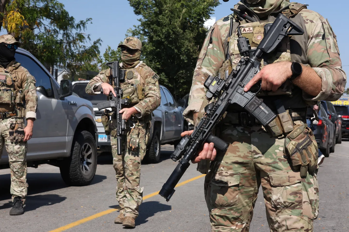 US agent shoots allegedly armed woman in Chicago as protests continue