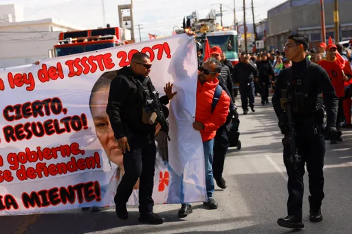 Protesters take to Mexico City’s streets during military parade amid rising insecurity