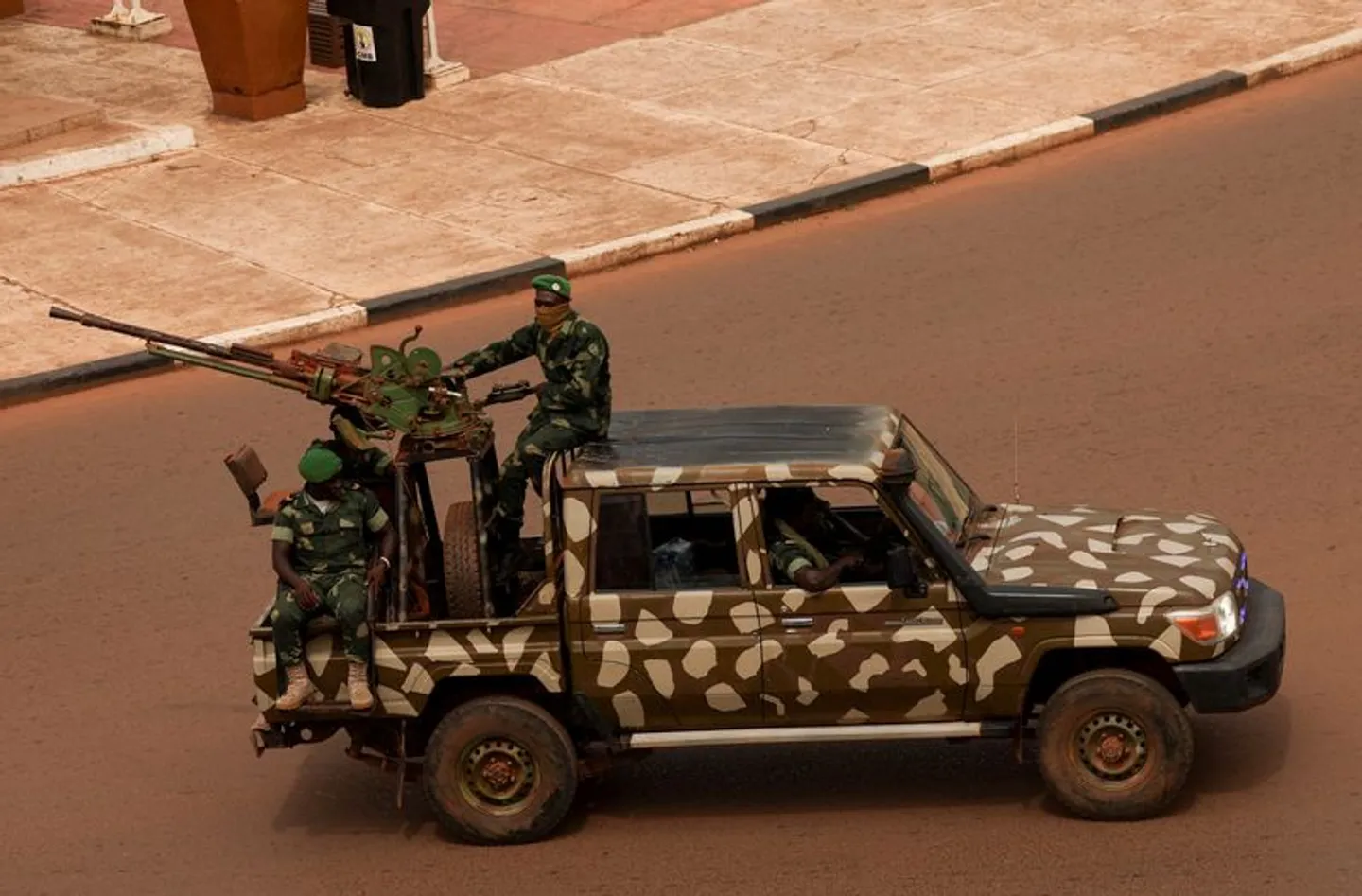 Soldiers patrol near the presidential palace in Bissau