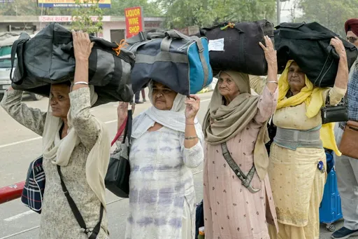 Indian Sikh pilgrims cross into Pakistan in first major border opening since May clashes