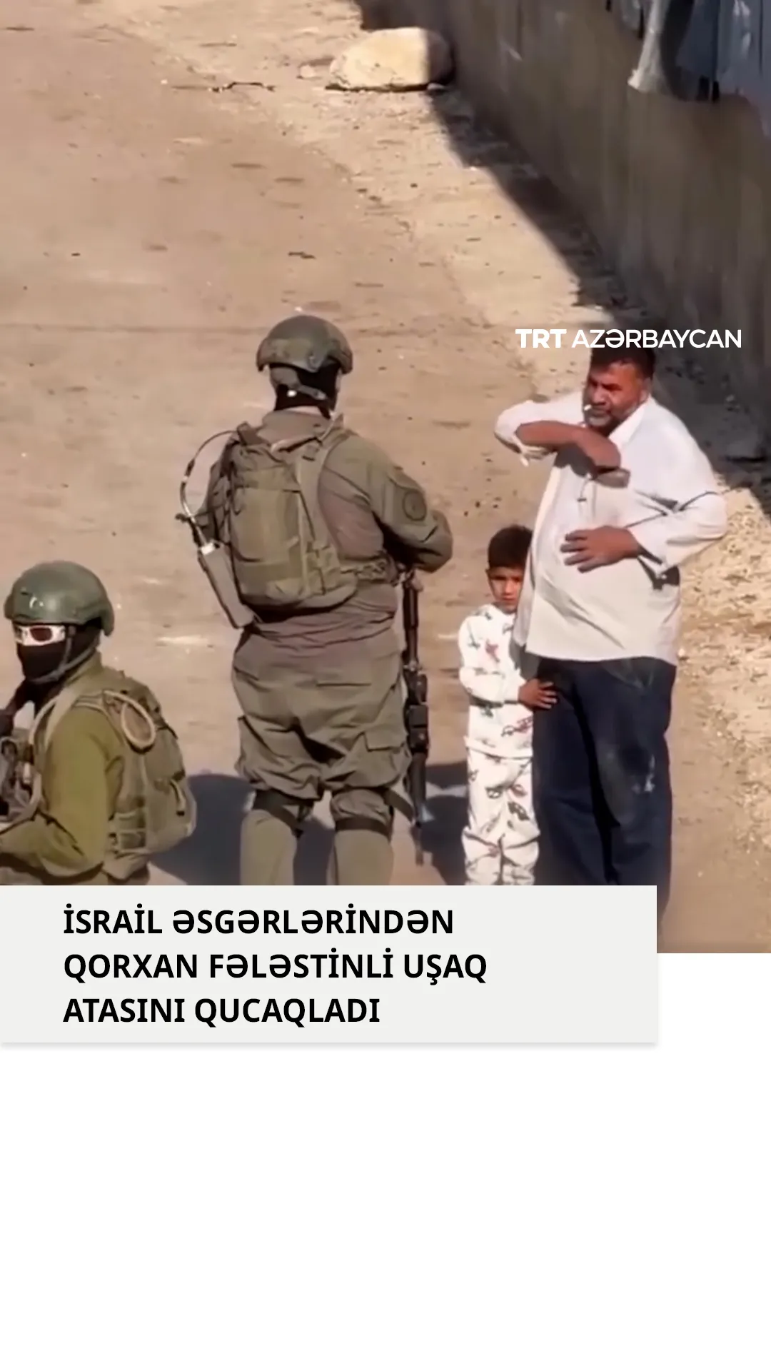 İsrail əsgərlərindən qorxan fələstinli uşaq atasını qucaqladı