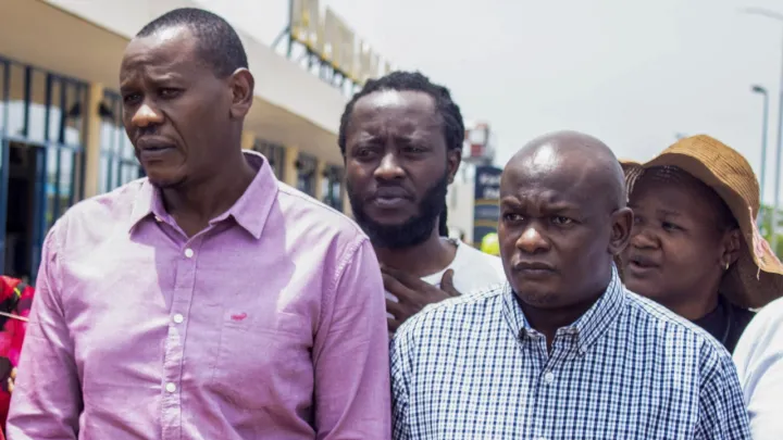 Kenyan activists arrive home after their release from custody in Uganda