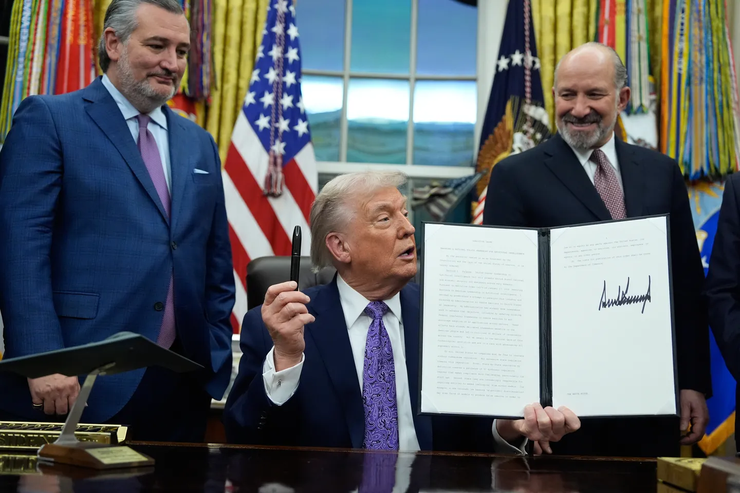 Trump signs executive order to curb state AI laws