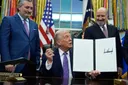 Trump signs executive order to curb state AI laws