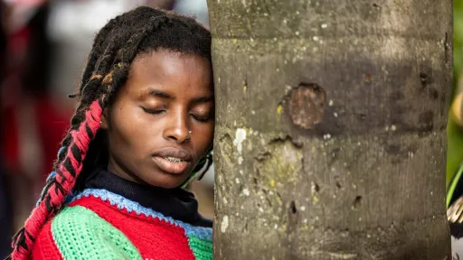 Kenyan climate activist, 22, sets world record after hugging a tree for 72 hours