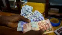 Ghanaian and Zambian currencies could slip, Reuters projections show