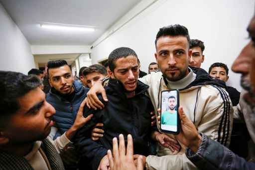 A group of Palestinian detainees released by Israeli forces are welcomed upon arrival in Deir al Balah