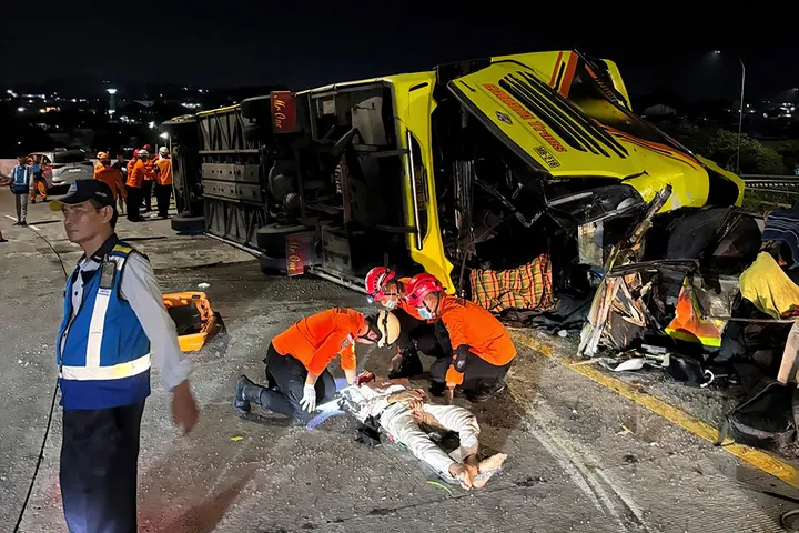 Passenger bus crash in Indonesia kills at least 16 people, a rescue worker says