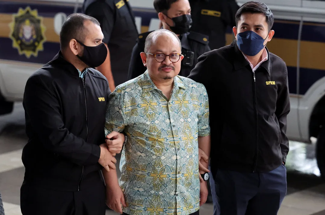 Malaysia charges PM's former aide with receiving bribes, eroding trust in govt anti-graft efforts