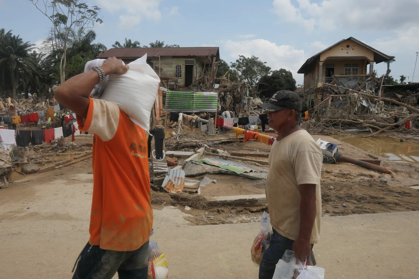 Indonesia reels as floods and hunger ravage remote Sumatran communities
