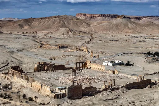 Palmyra gunman who killed Americans was to be fired from Syrian security forces for 'extremism'