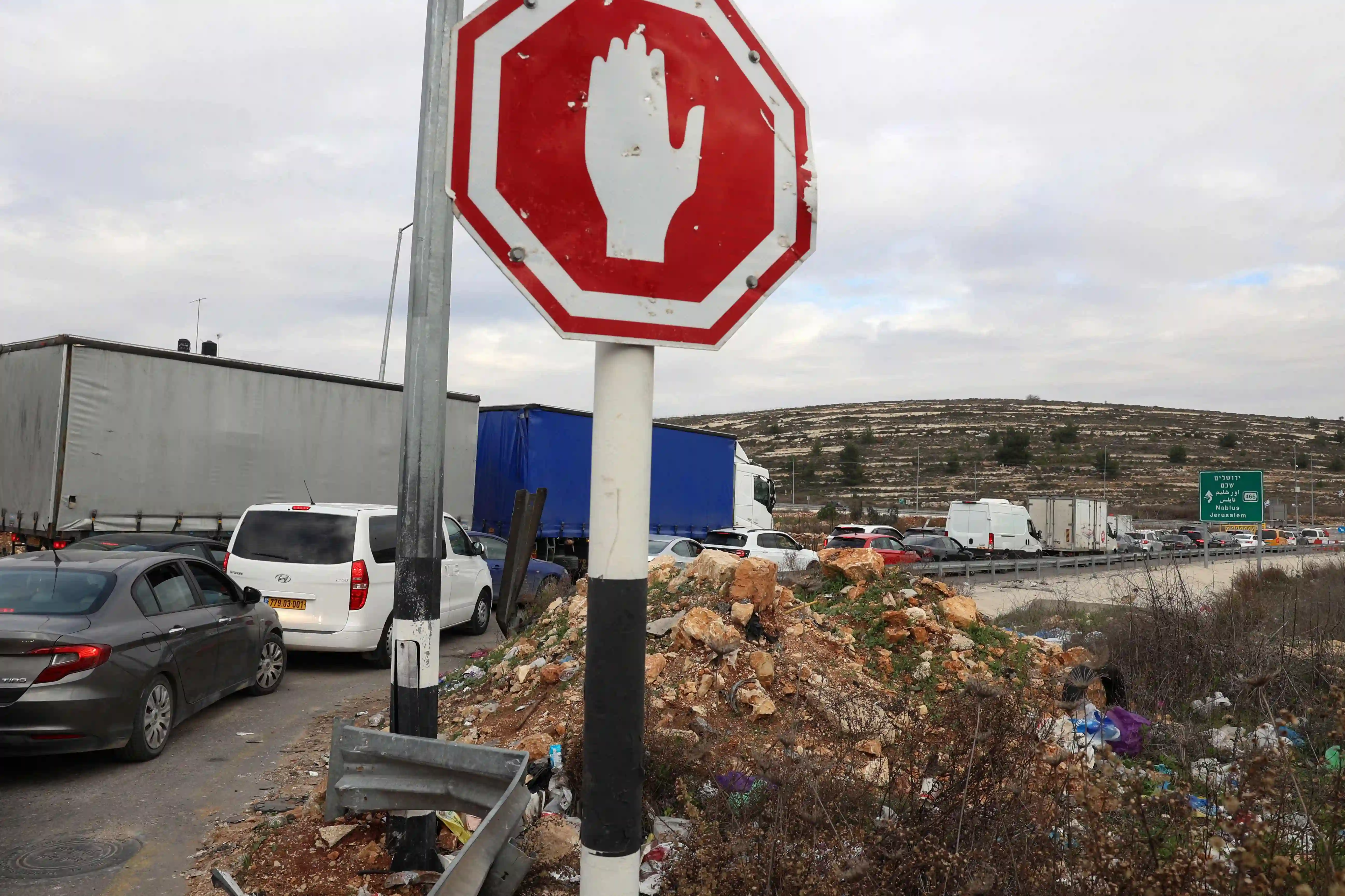 In the occupied West Bank, Israeli checkpoints carve through Palestinian land