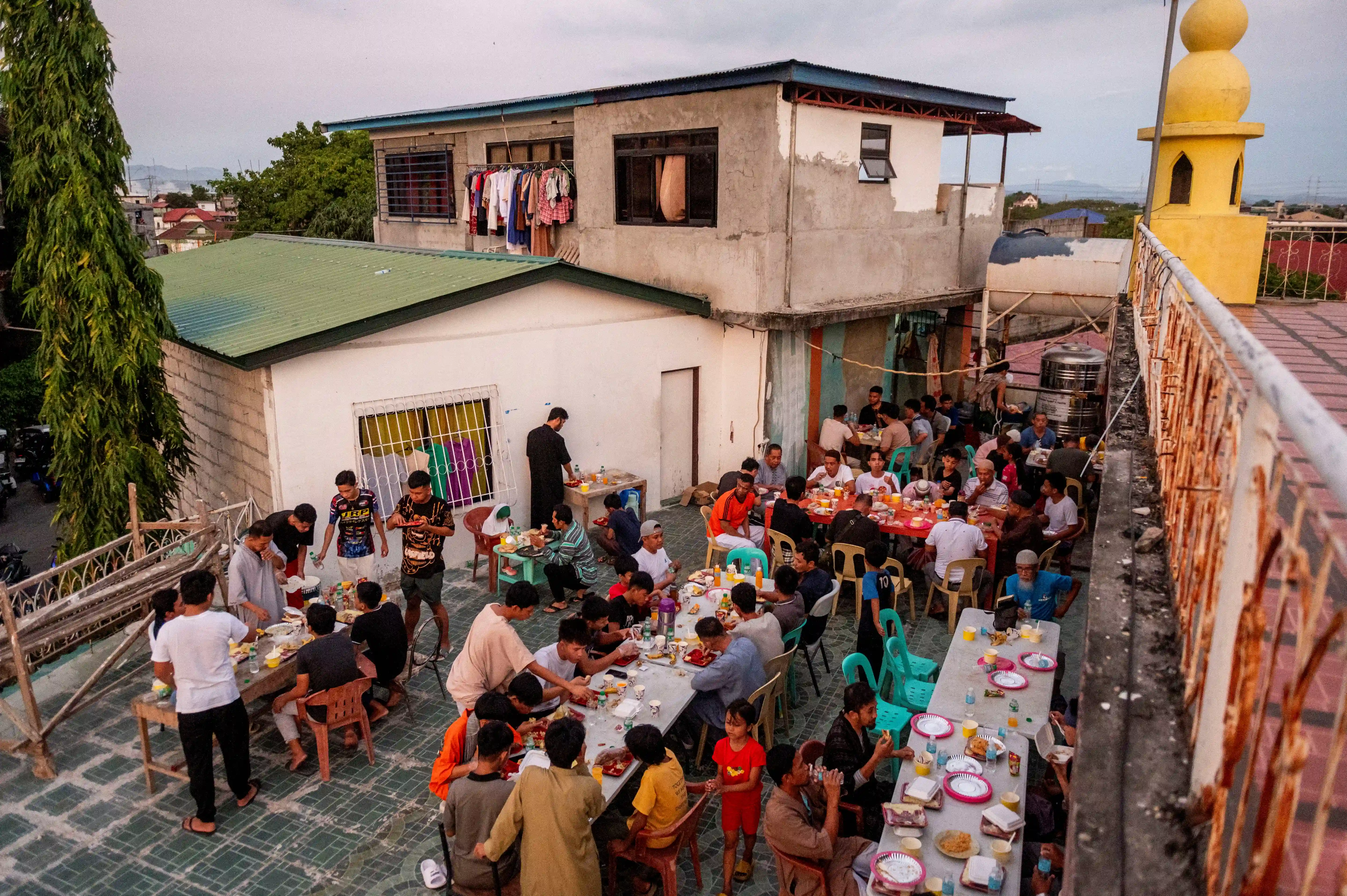 Communal iftar (breaking of the fast) meals, like this one at the at the Garden Mosque, in Manila, Philippines, nurture social ties (Reuters/Lisa Marie David).