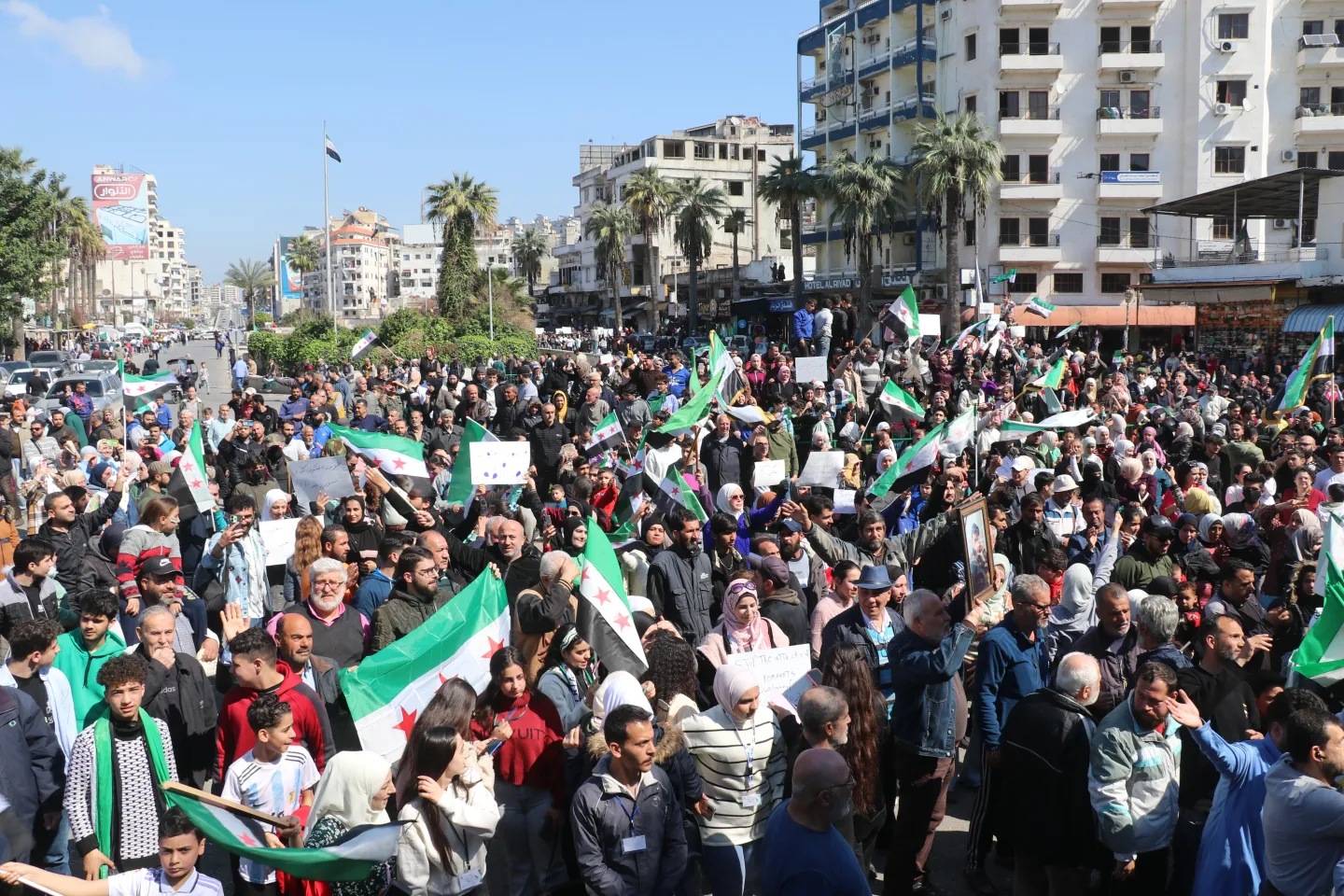 Syrians rally in support of new government after attacks by Assad loyalists
