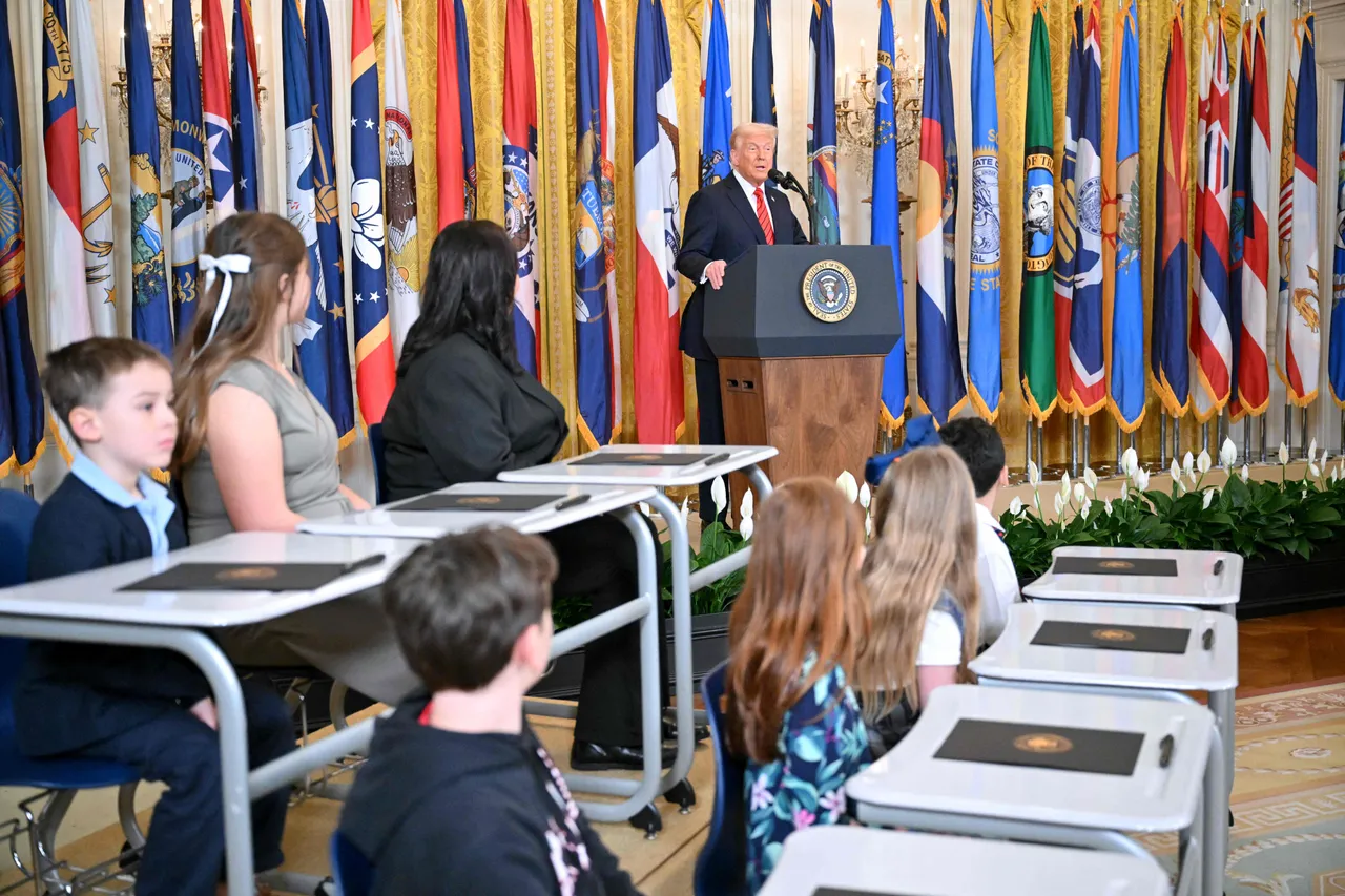 Flanked by school kids, Trump signs order to dismantle Department of Education