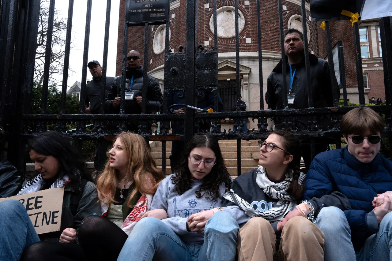 Students chain themselves to Columbia University's gate to demand release of Khalil