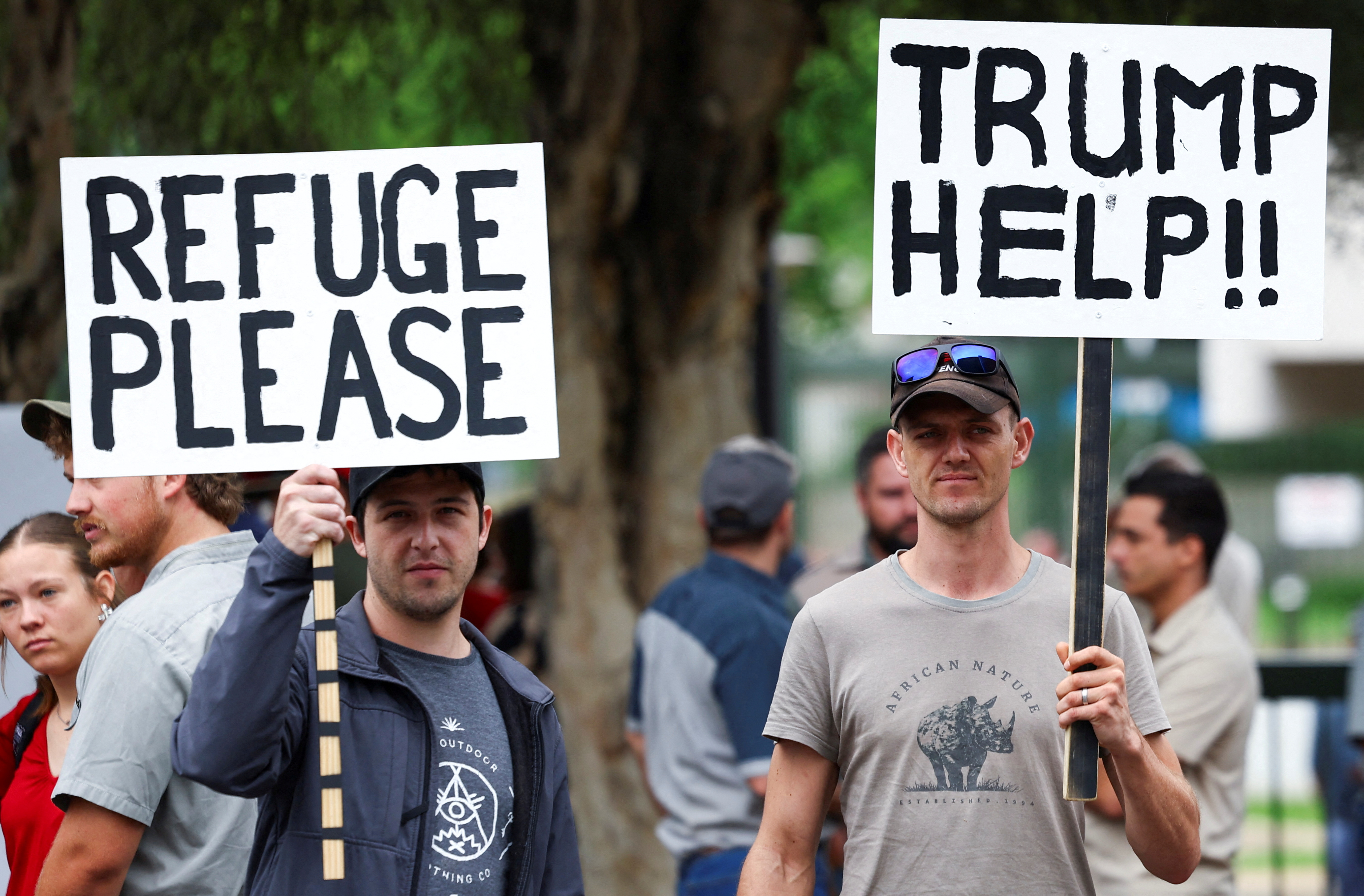 First white South Africans board plane for US under controversial Trump refugee plan