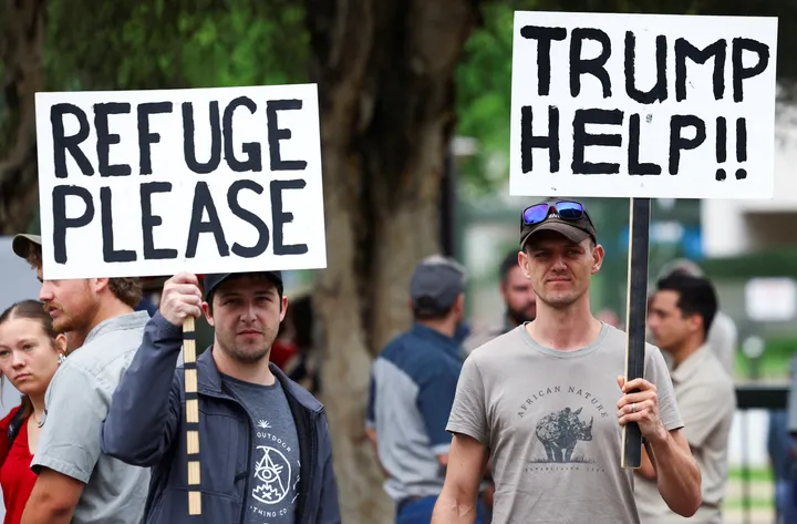 First white South Africans board plane for US under controversial Trump refugee plan