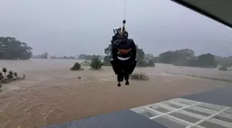 Thousands stranded in flood waters as torrential rain pummel eastern Australia