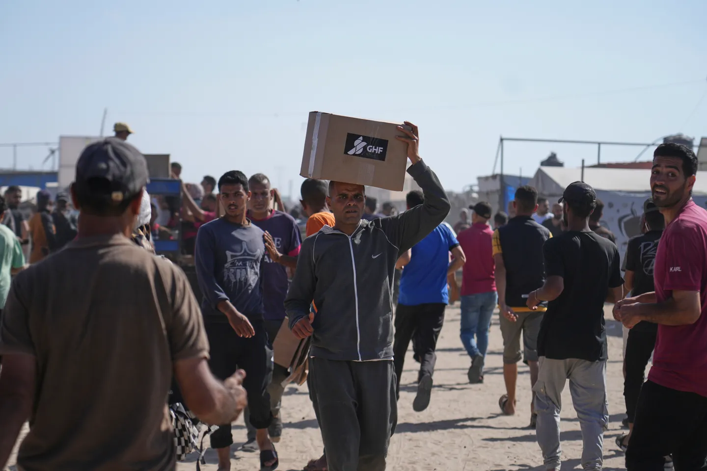 Israeli troops open fire on Palestinians seeking aid, several wounded
