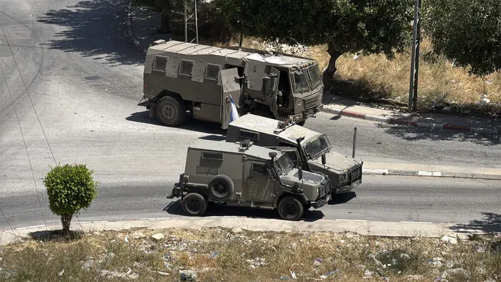 Israeli military vehicle rams bus carrying Hajj pilgrims in Jenin during West Bank raid