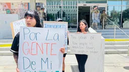 Los Angeles protests: As second-largest US city sleeps under curfew, families 'scream into fences'