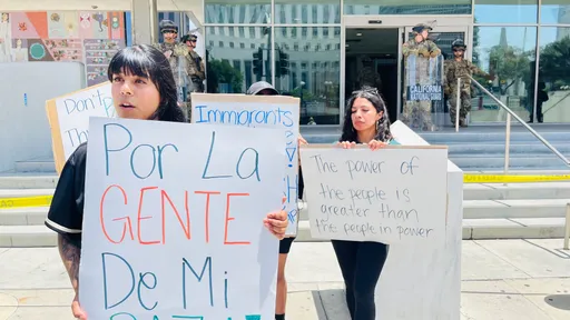 Los Angeles protests: As second-largest US city sleeps under curfew, families 'scream into fences'