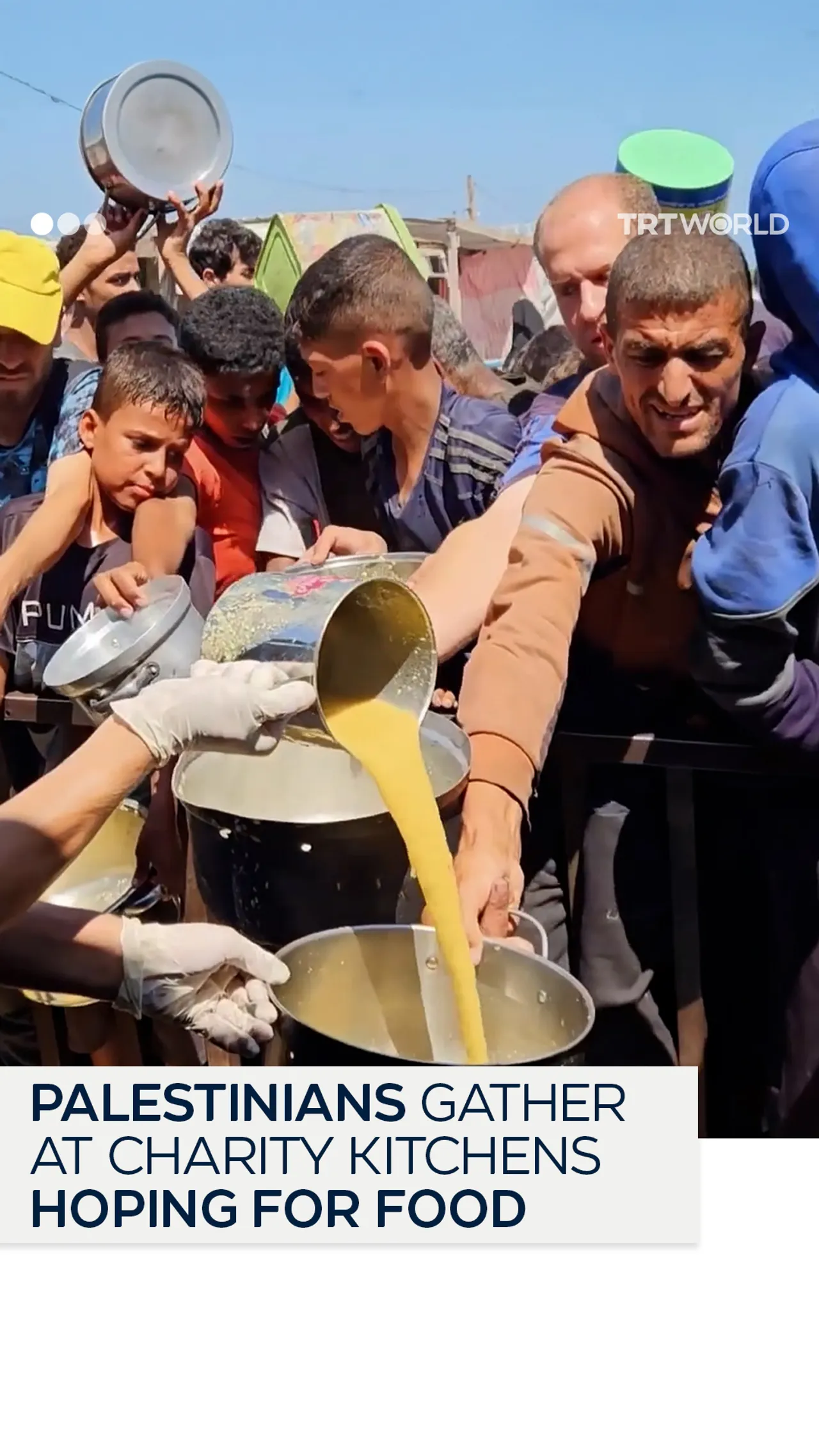 Palestinians in Gaza gather at charity kitchens amid Israeli siege