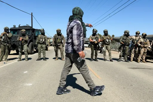 Tense standoff as US authorities arrest 200 immigrants in raids on two California farms
