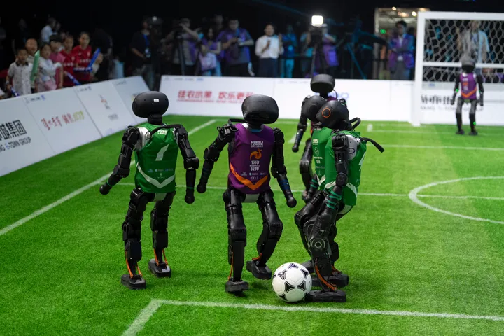 AI-powered humanoid robots play world's first football match in China