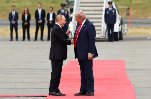 In pictures: Trump, Putin walk down red carpet in Alaska for historic handshake