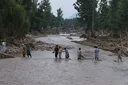 Pakistan flood death toll tops 300 as heavy rains continue to batter north