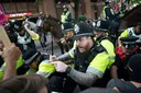 Anti-migrant, anti-racism groups clash at UK asylum hotel
