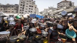 Israeli troops kill 20 Palestinians, including 15 waiting for food aid, in Gaza