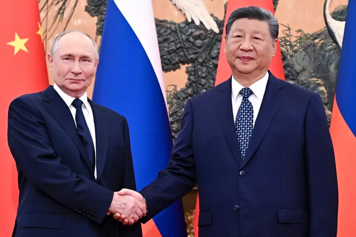 Putin and Xi meet in Beijing days after Trump's high-profile China visit