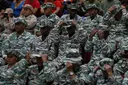 Maduro masses 25,000 troops on Venezuelan borders as US warships close in