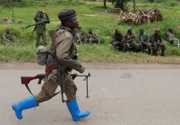 Dozens of mourners killed by suspected rebels at a funeral in eastern DRC