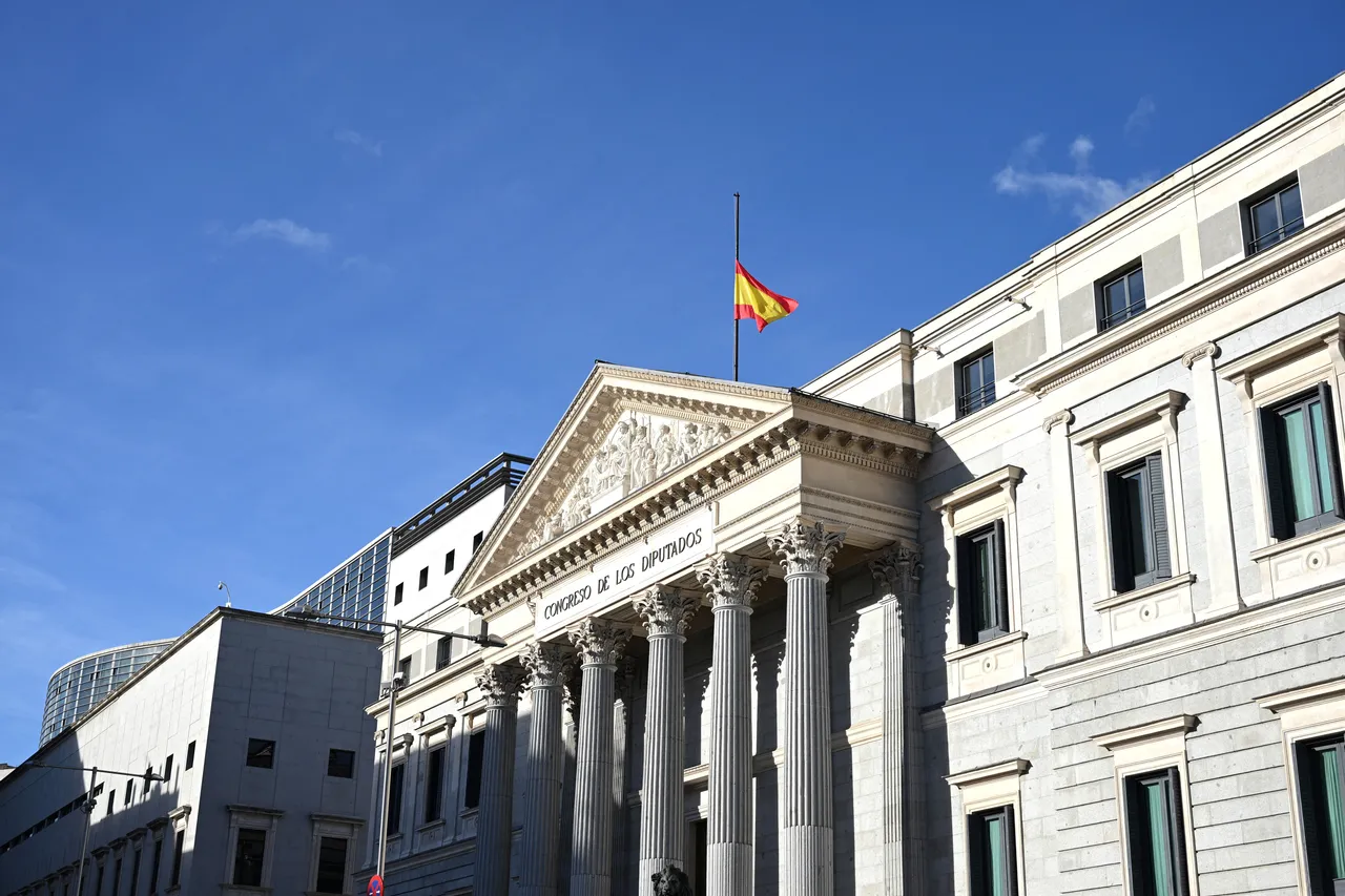 Spain lowers flags as rescuers search wreckage after deadly train crash