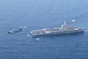 US aircraft carrier enters Middle East as Iran and Hezbollah warn against potential attack