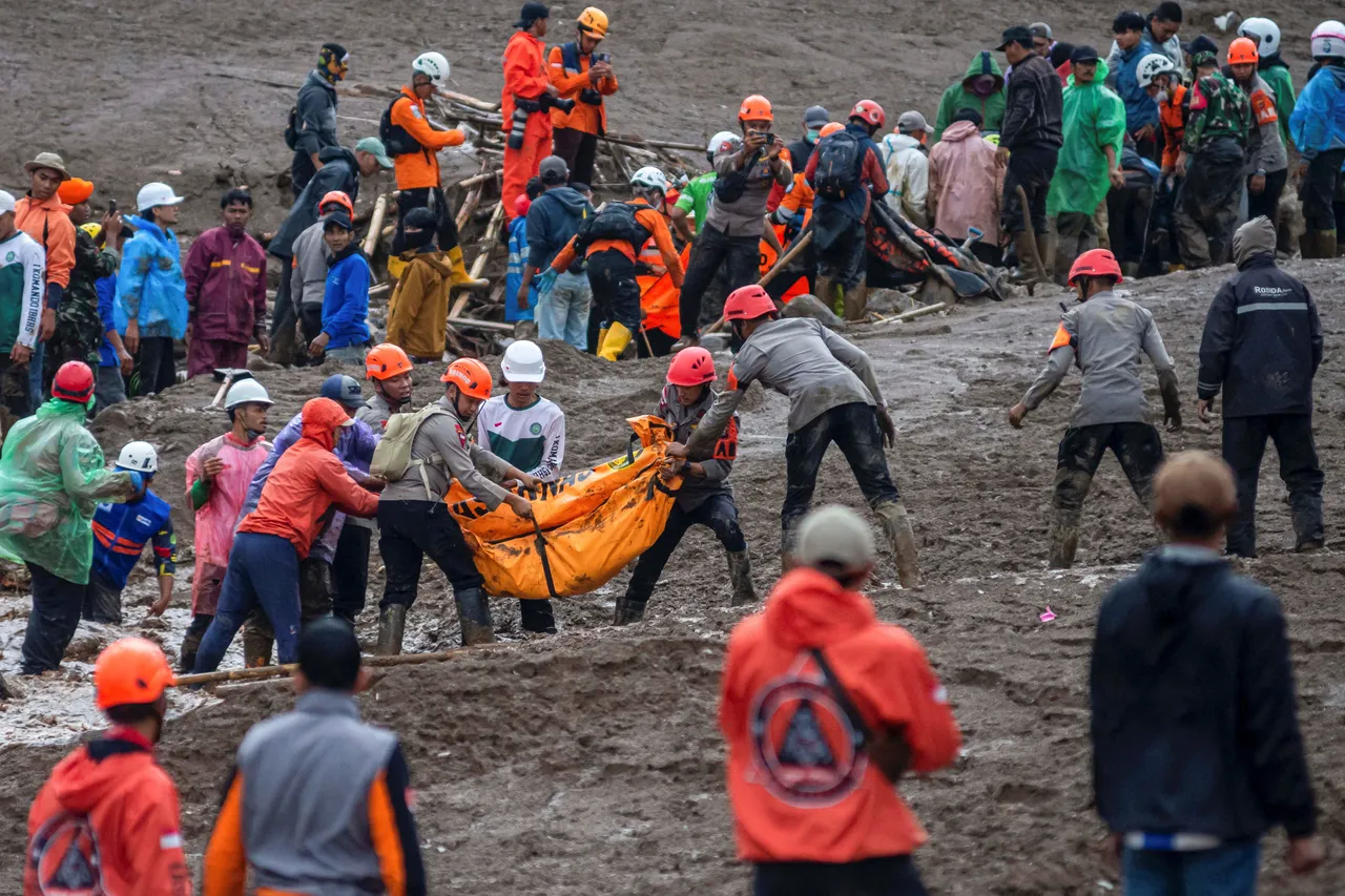 Rescuers race through deep mud as landslide toll rises in Indonesia