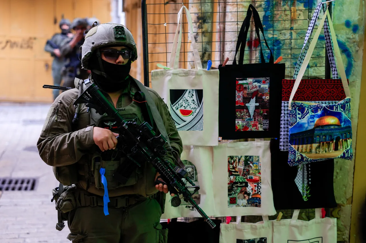 Israeli forces raid occupied West Bank's Qalandiya, close roads north of Jerusalem