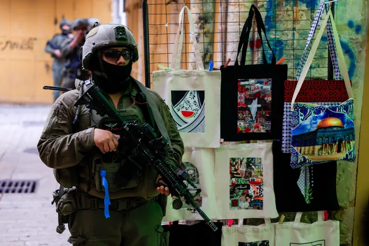 Israeli forces raid occupied West Bank's Qalandiya, close roads north of Jerusalem