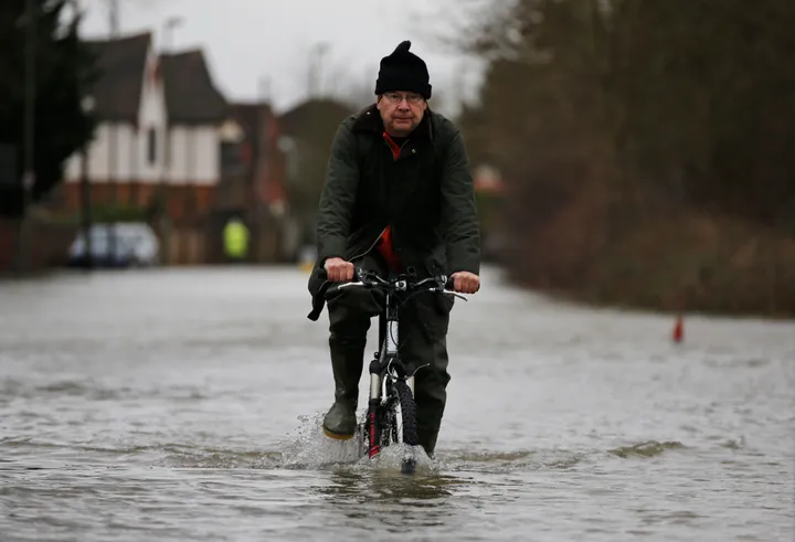 Hundreds of homes flooded as record rainfall batters parts of the UK