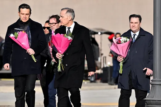 Mark Carney visits memorial as new details surface about Canada shooting