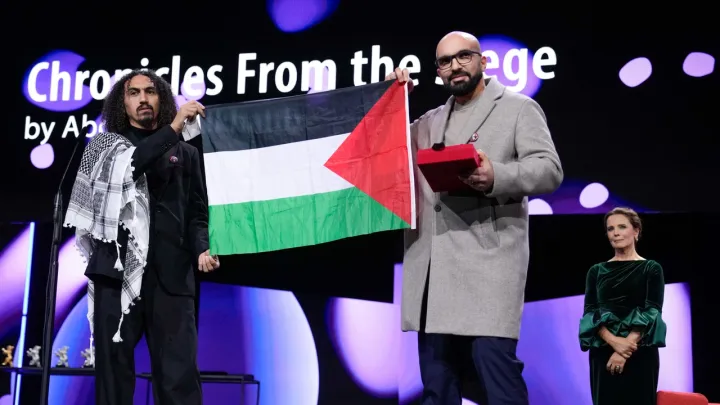 Hundreds of filmmakers back embattled Berlin festival chief over Palestinian flag photo